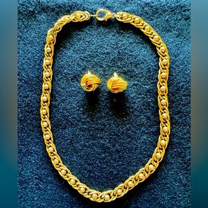 Gold tone chain necklace and matching post earrings.